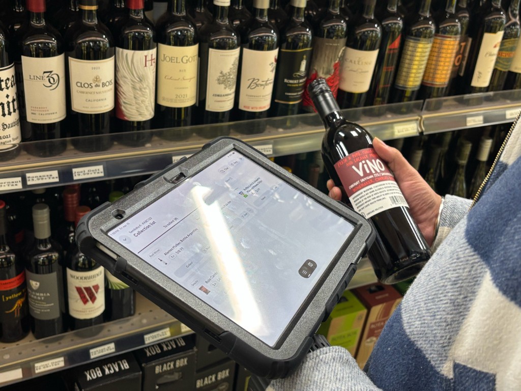 Testing the picking prototype on an iPad in a store's wine aisle